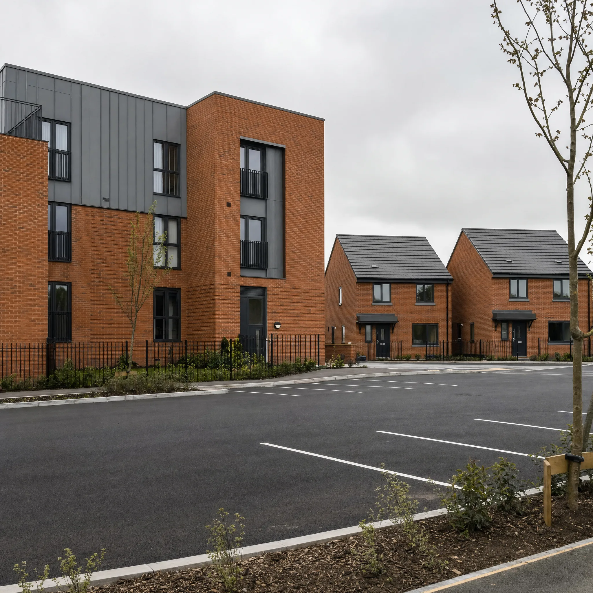 UK mixed residential development with multi-storey apartment block and family homes